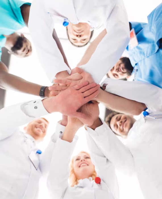 group-doctors-are-holding-each-other-s-hands_85574-8280